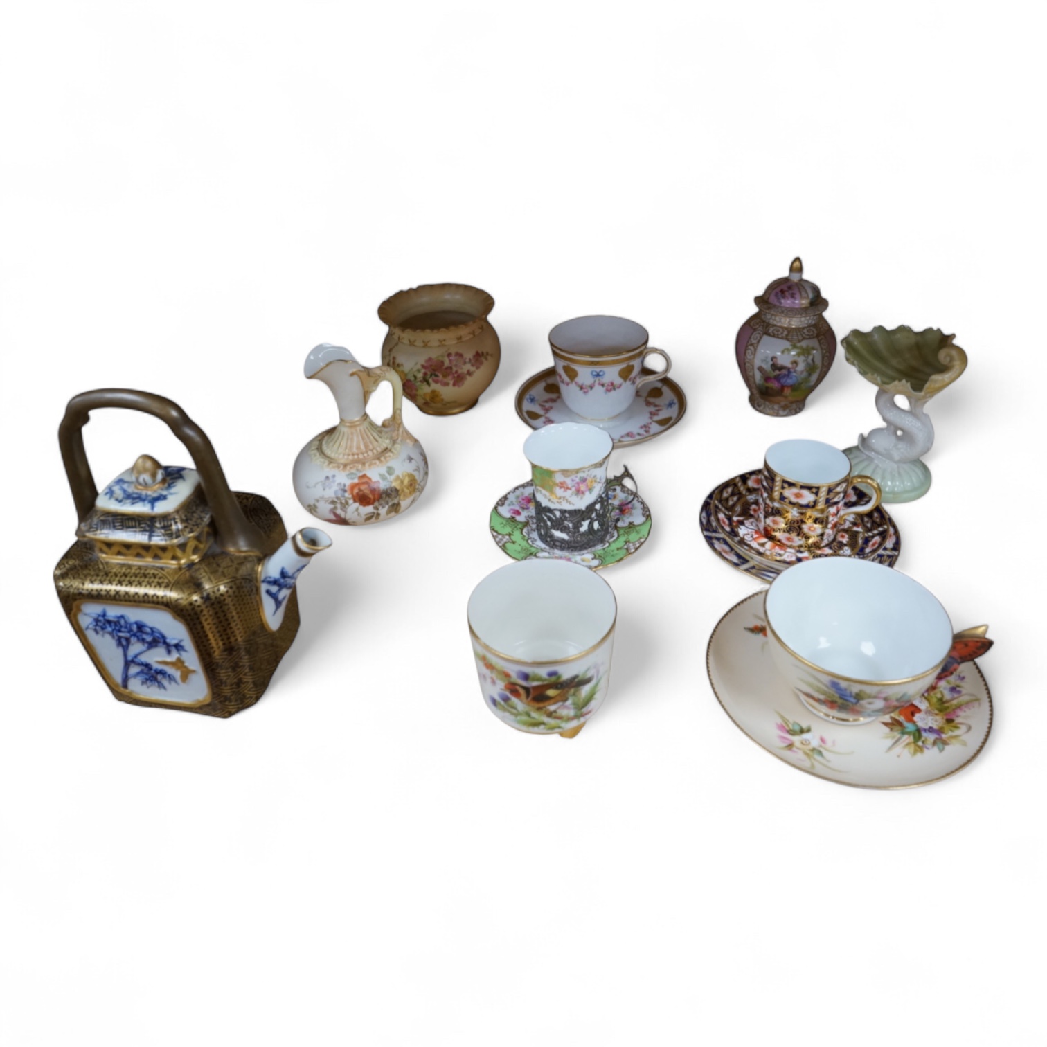 A Worcester butterfly handled cup and saucer and four other items, together with Royal Crown Derby, Dresden and Coalport items. (9). Tallest 13 cm